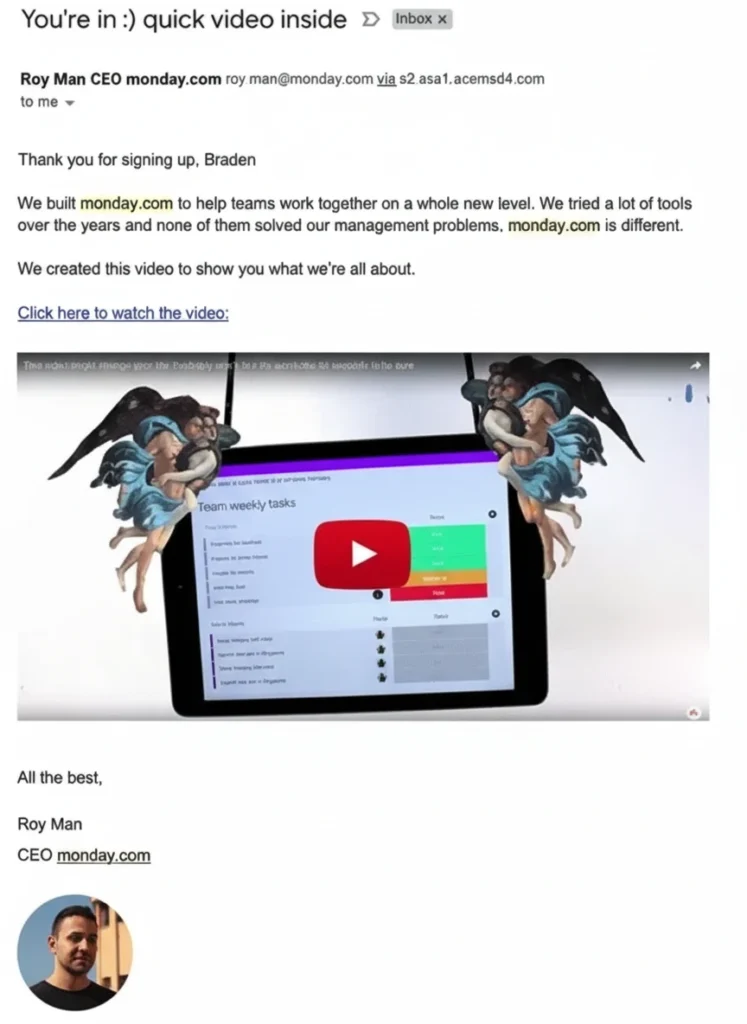 12 Great Examples of Welcome Emails for New Customers [Templates] - A screenshot of a welcome email from monday.com CEO Roy Man, featuring a personalized greeting, an embedded video thumbnail of the platform, and angels holding up a tablet.